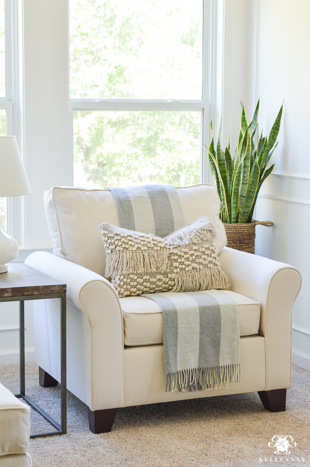 oversized white chair in the bedroom sitting area