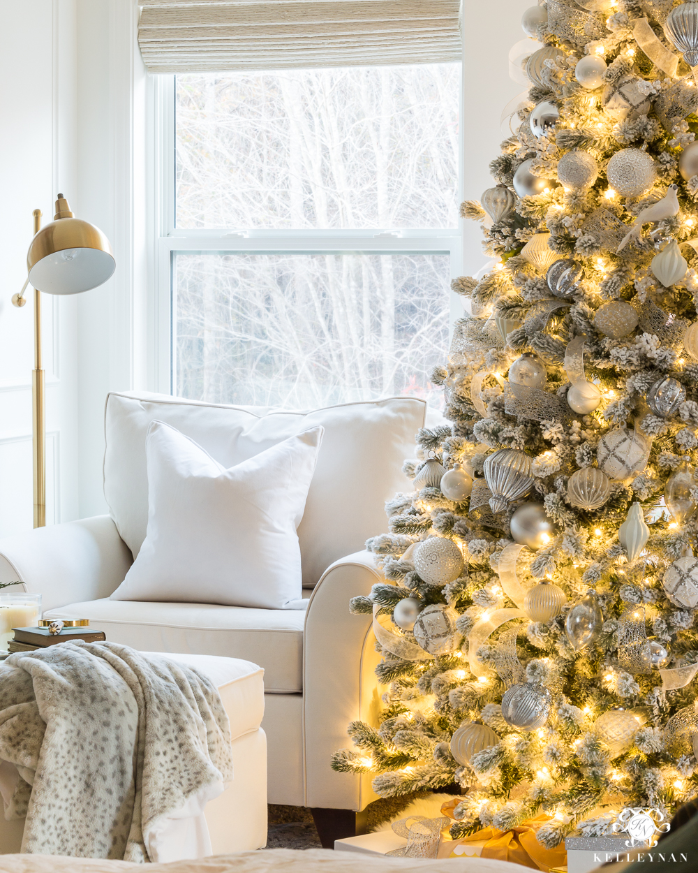 Cozy bedroom sitting area with a flocked Christmas tree