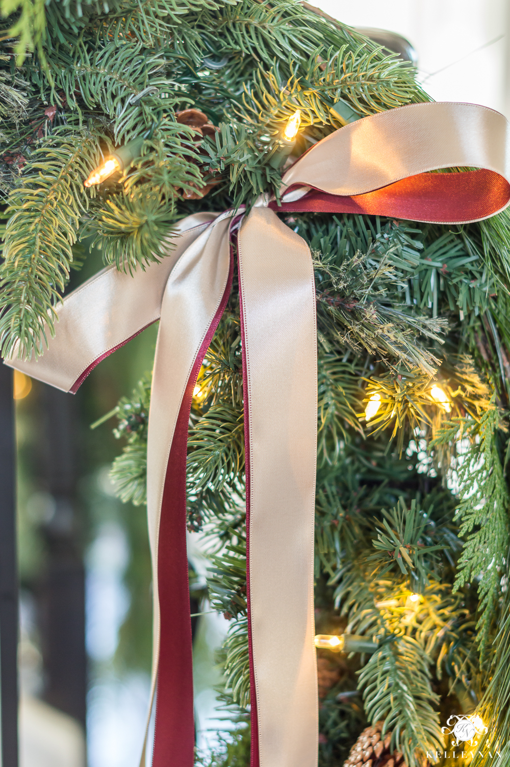 How to tie ribbon on stairwell banisters with garland