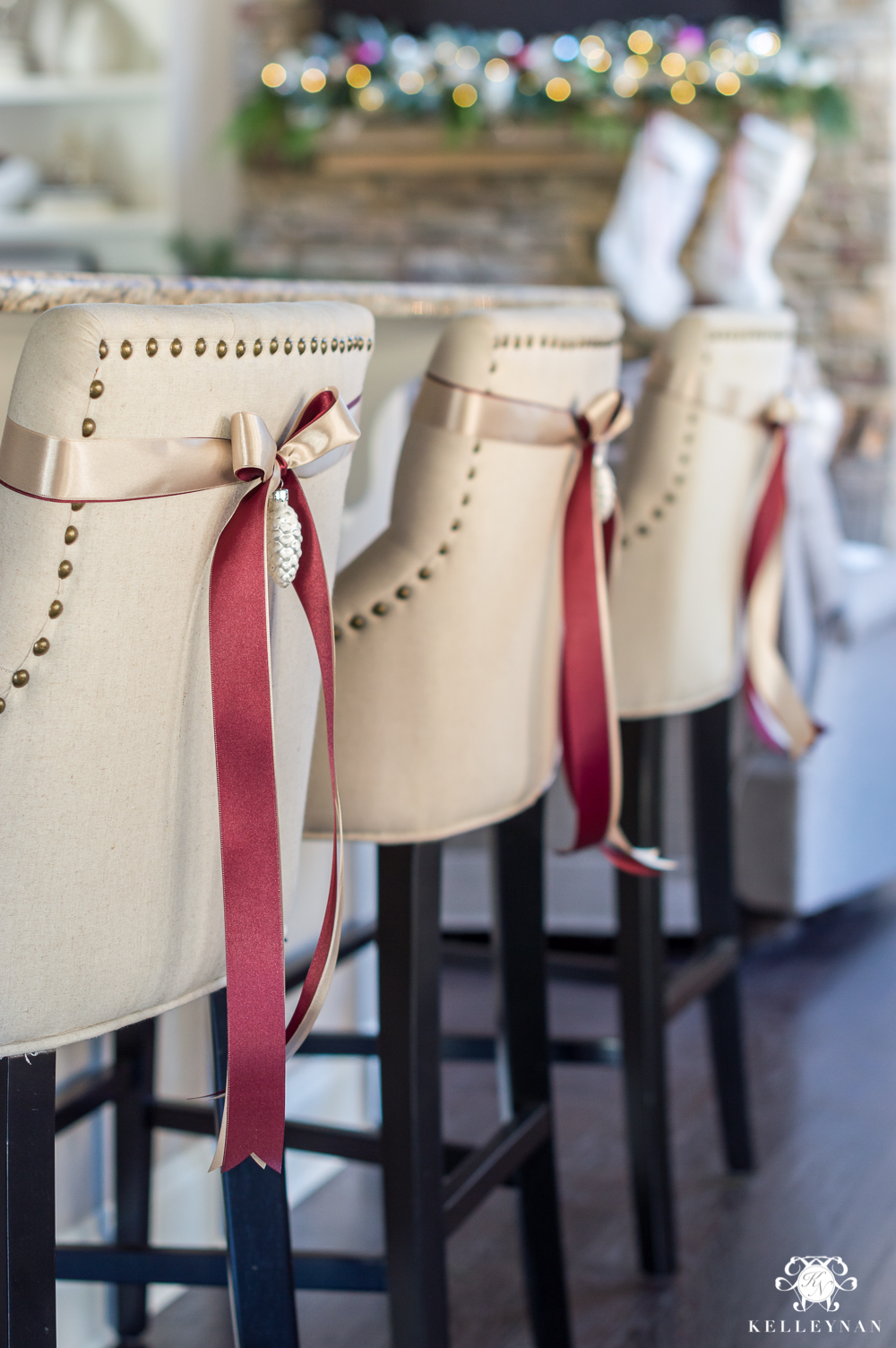 Bar stools with ribbon and an ornament for Christmas