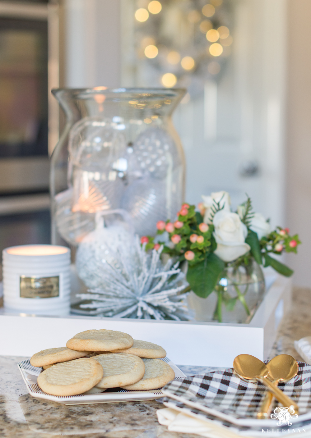 Kitchen island Christmas decor with a jar of ornaments