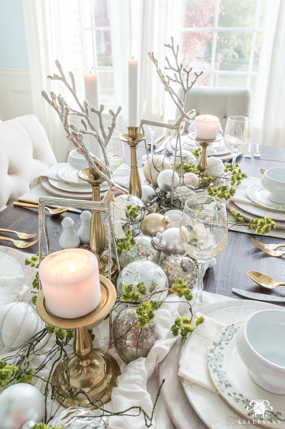 Christmas centerpiece ideas with reindeer, moss, and ornaments