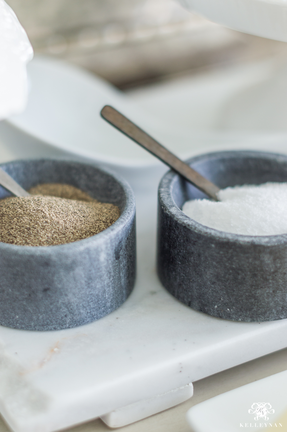 Salt and pepper dishes with spoons