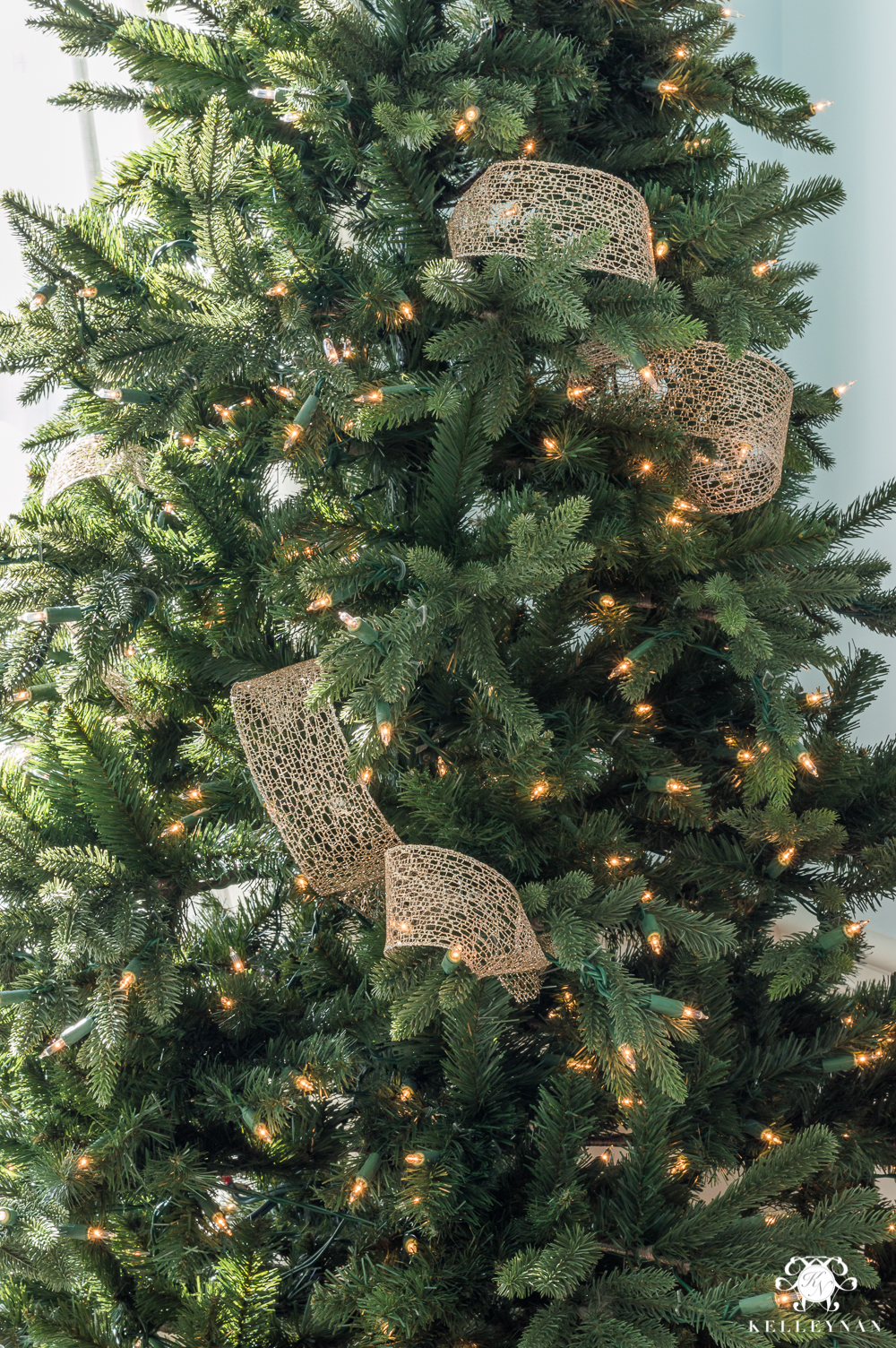 christmas trees decorated with mesh ribbon