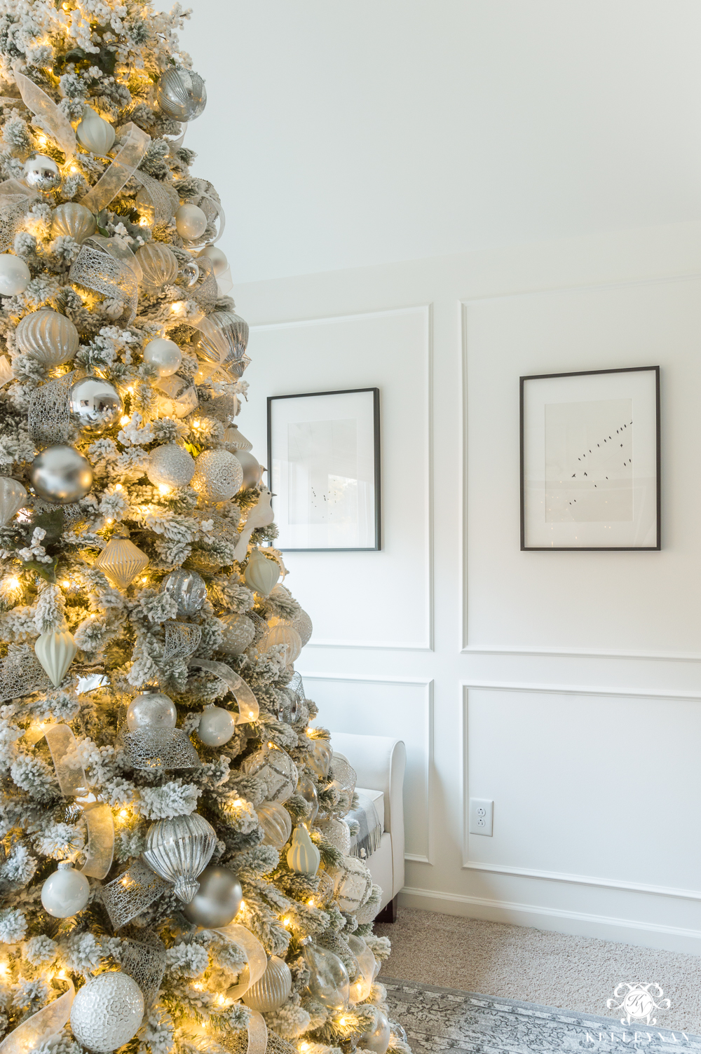 silver and white christmas tree in the bedroom sitting area