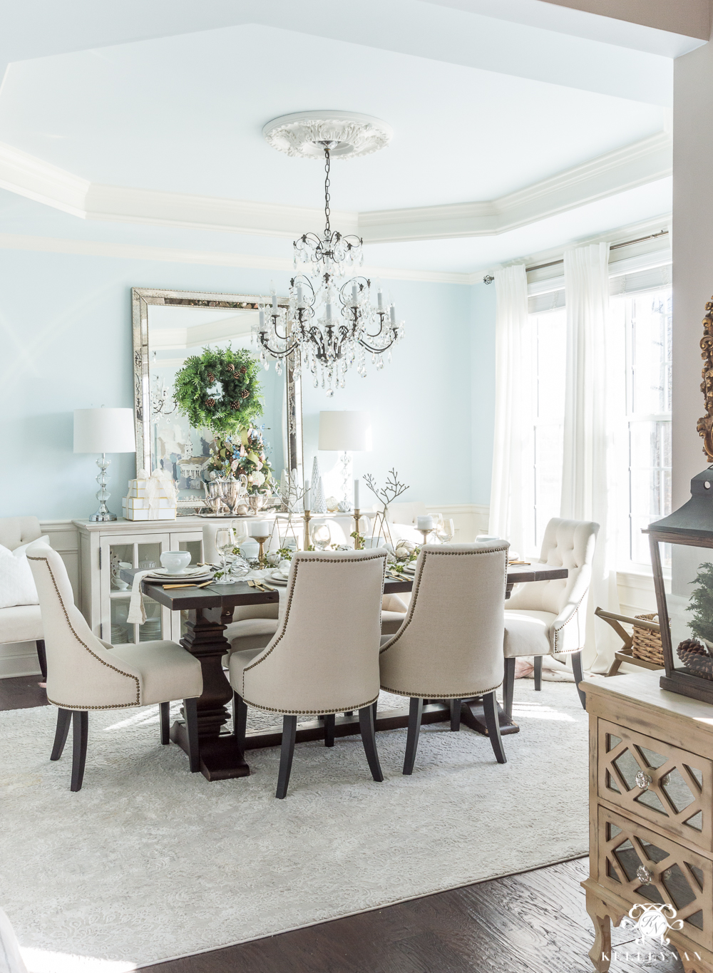 Elegant blue dining room decorated for Christmas