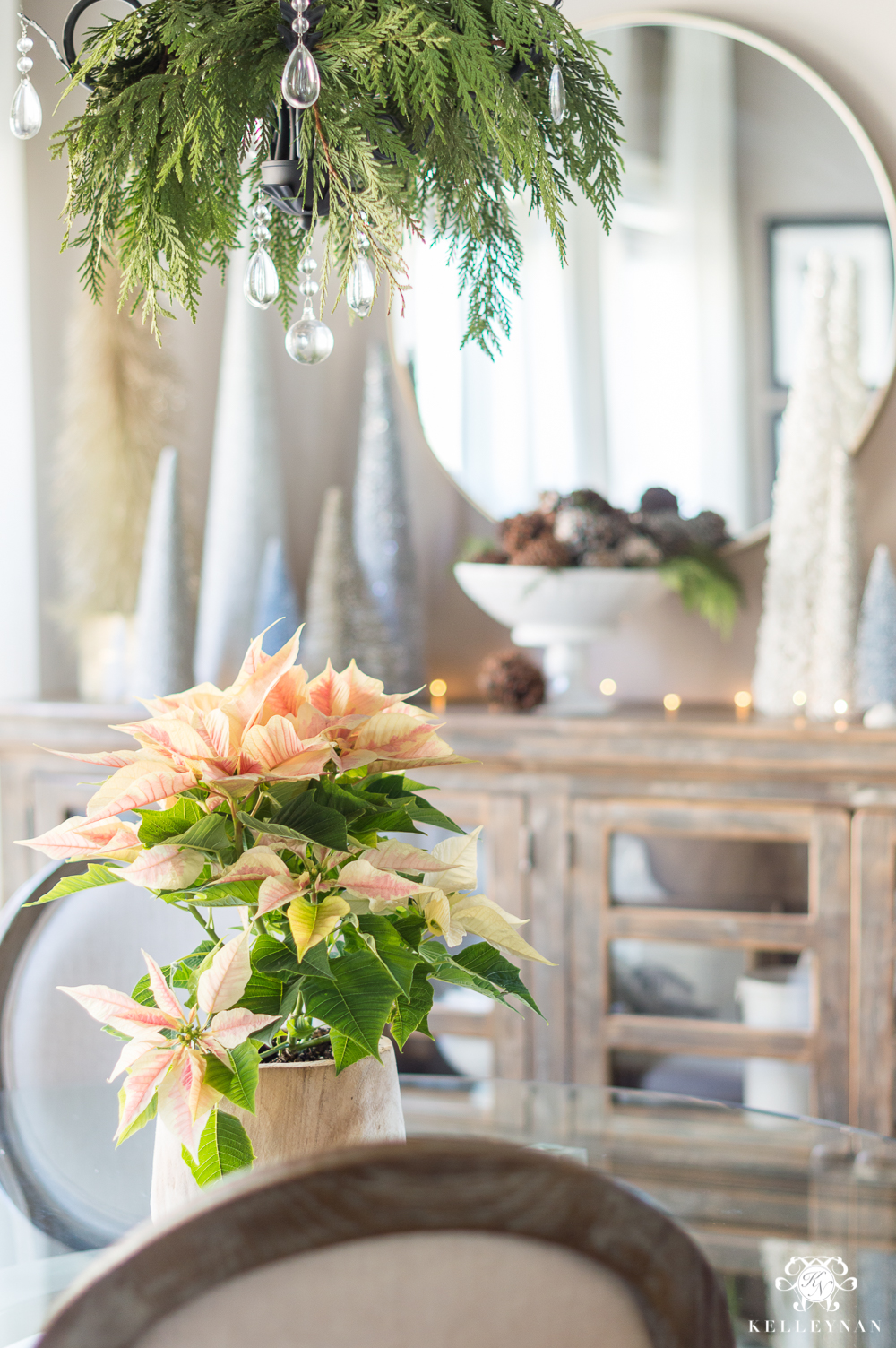 Pink poinsettia in wooden planter as a Christmas centerpiece