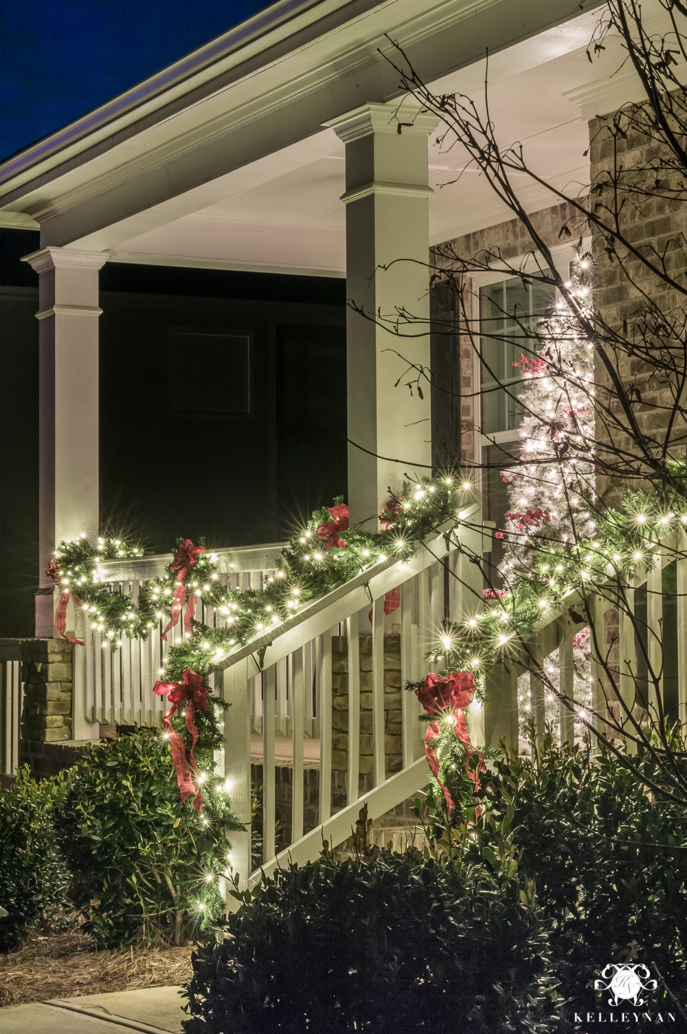 Classic christmas front porch with garland and christmas tree