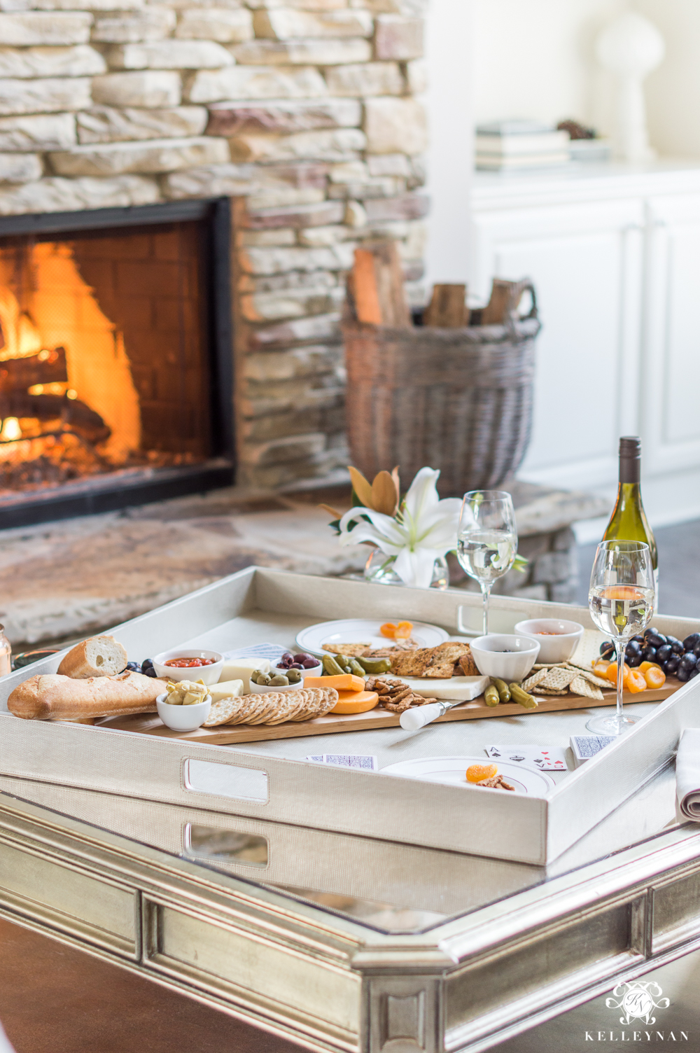 date night picnic at home with cheese and wine by the fire