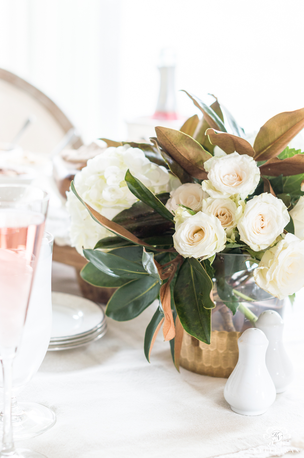 Rose, hydrangea, and Magnolia leaf table centerpiece for a Galentine's luncheon