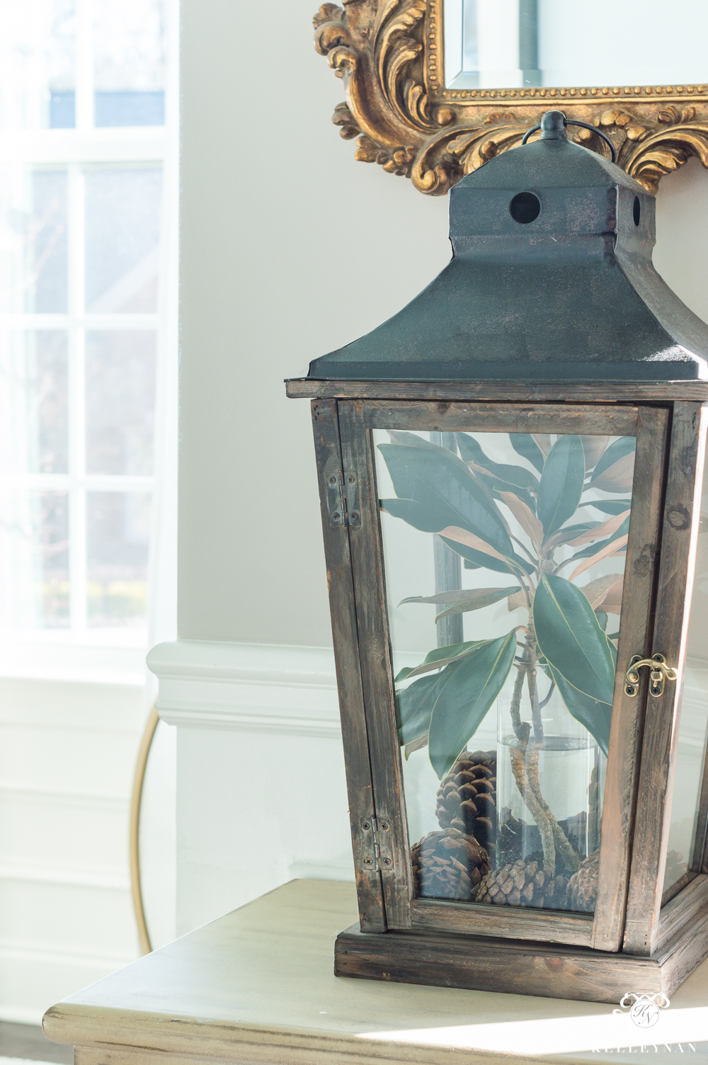 Easy lantern styling ideas with pinecones and magnolia leaves