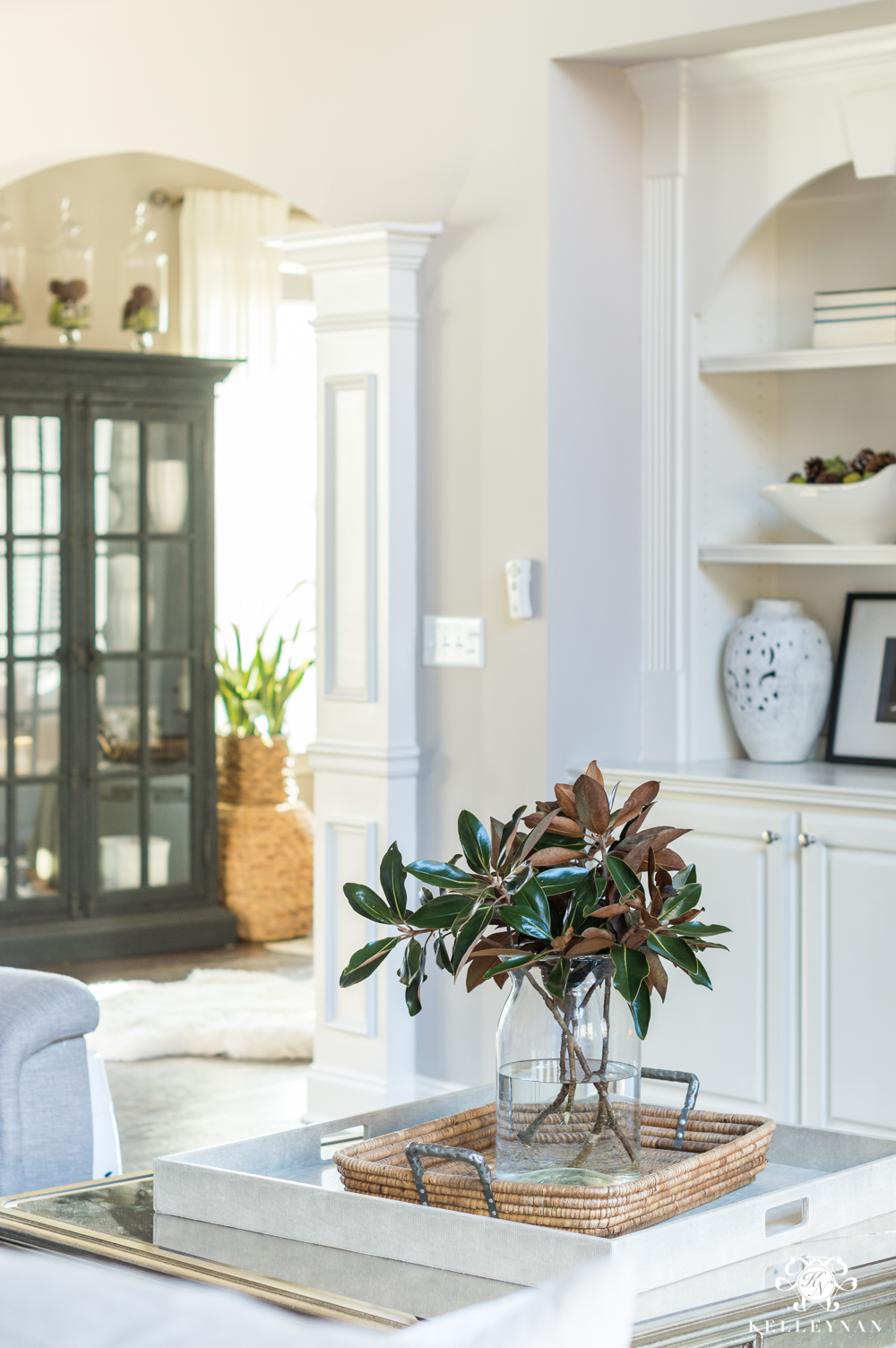 Coffee table decor with one magnolia leaf arrangement centerpiece