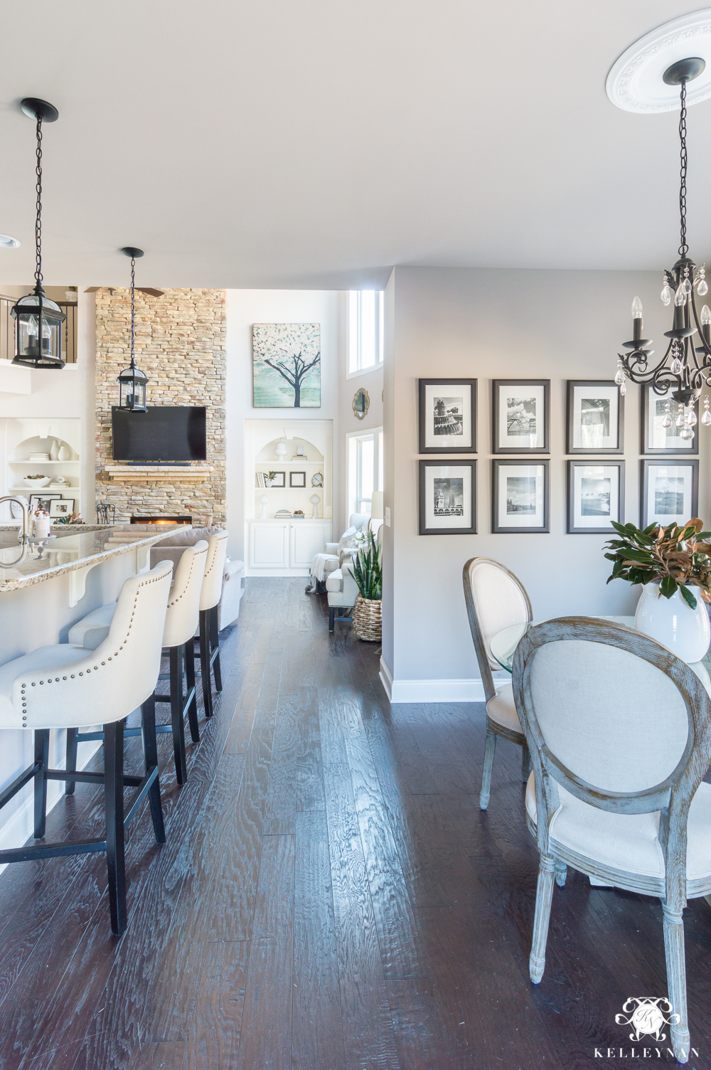 open home floor plan with winter decor from the kitchen into the living room 