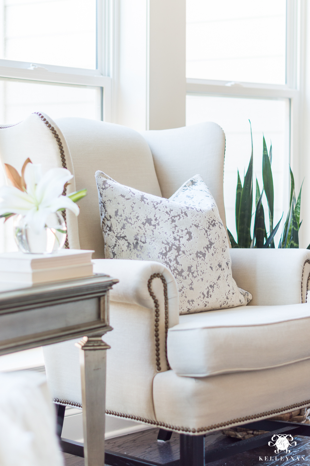 Wingback chair in the living room with velvet pillow for winter