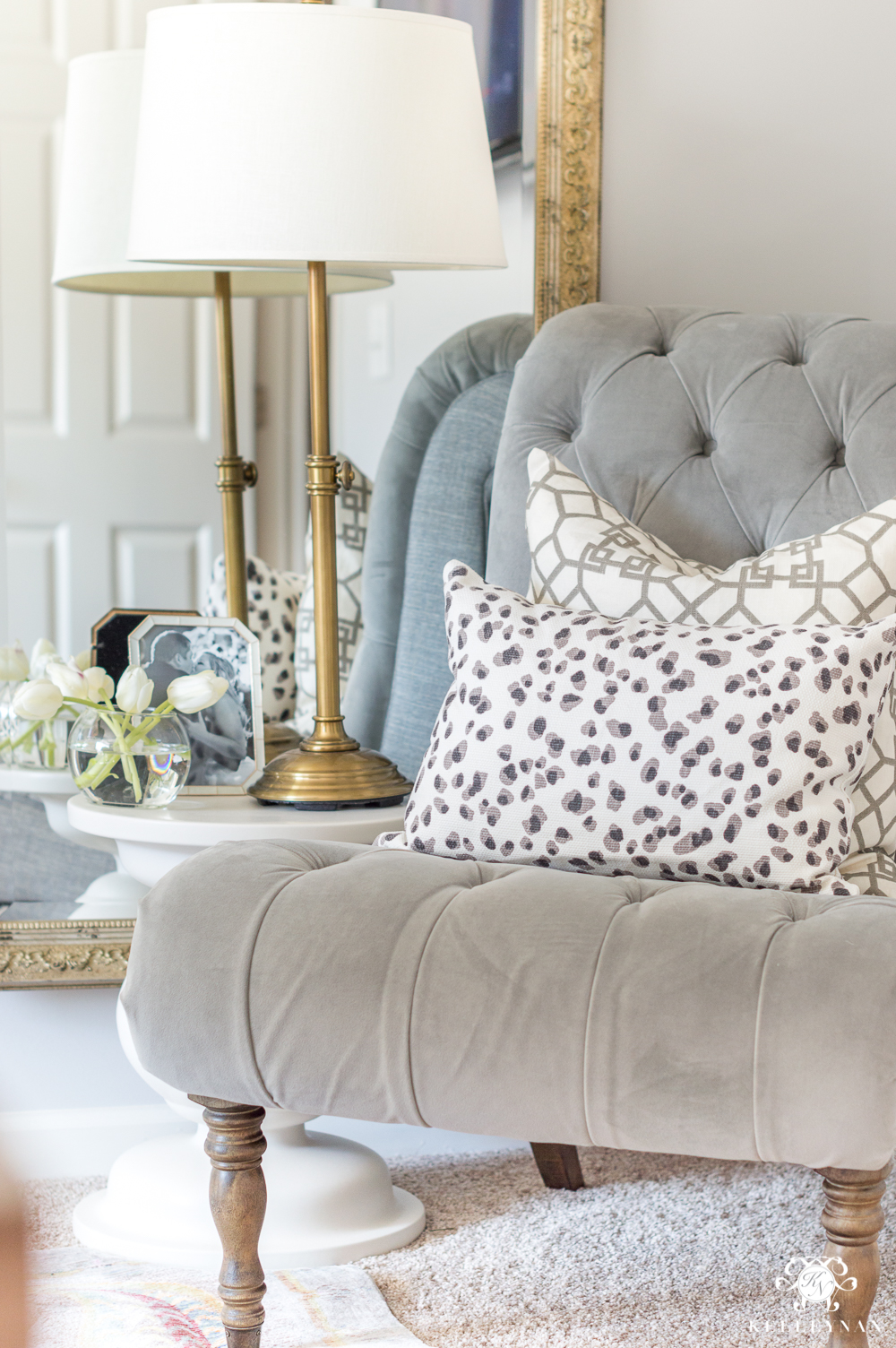 Tufted Gray Slipper Chair with Layered Patterned Pillows