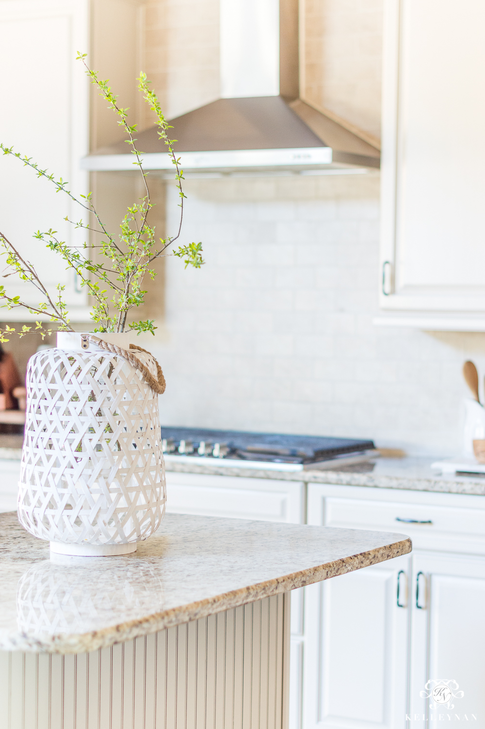 https://kelleynan.com/wp-content/uploads/2018/03/Traditional-Neutral-Kitchen-with-Cream-Cabinets-Decorated-for-Spring-8.jpg