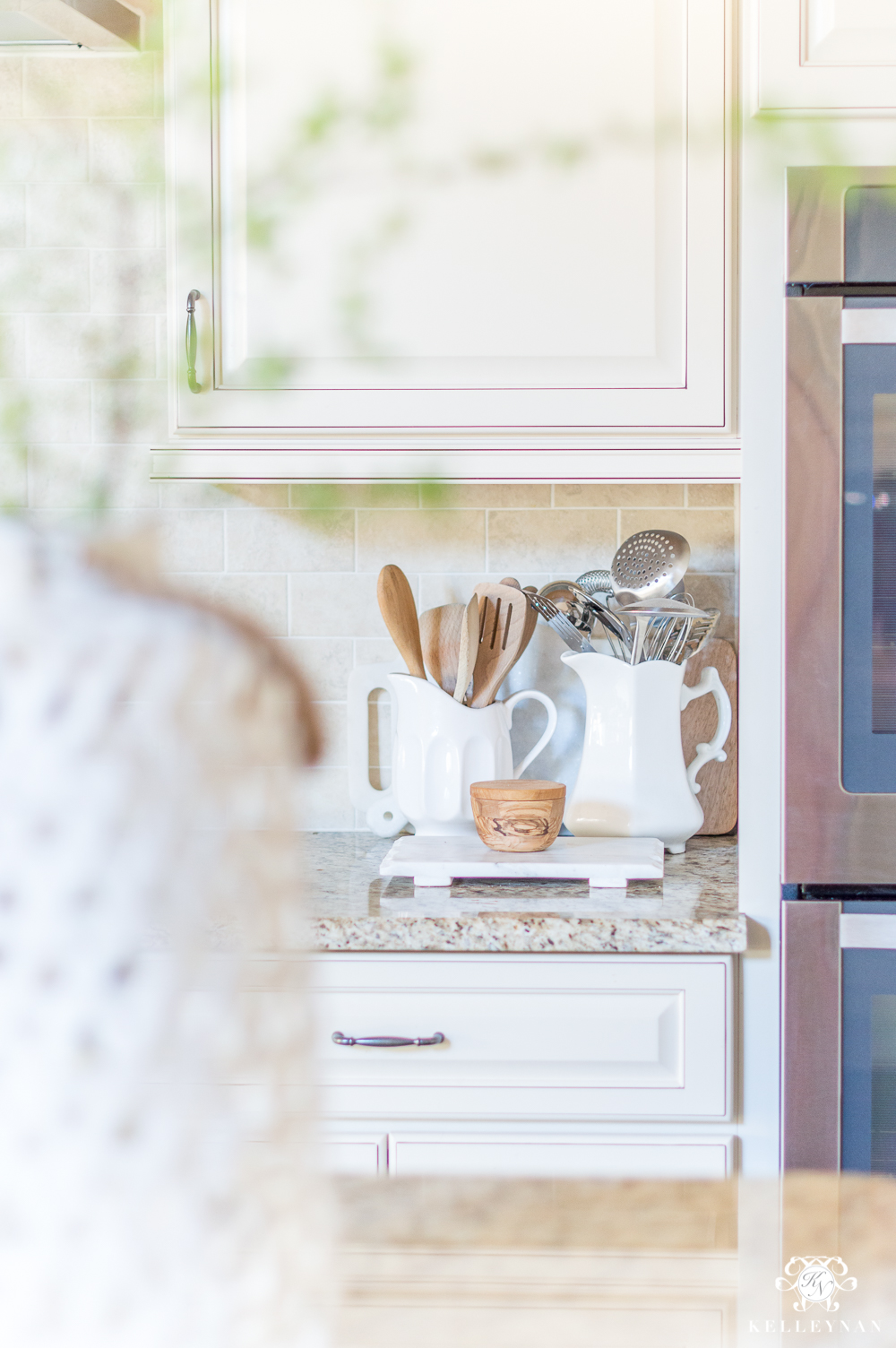 Kitchen Utensils in White Pitchers on Kitchen Counter- Styling IDeas