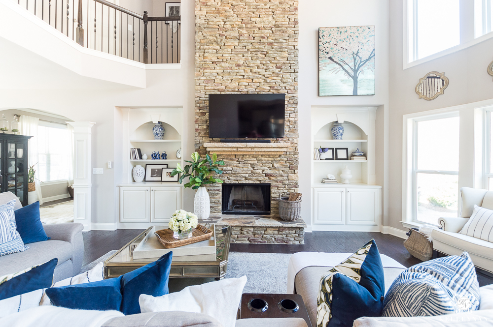 Family Room with Big Stacked Stone Fireplace and Built-Ins Flanking TV over fireplace