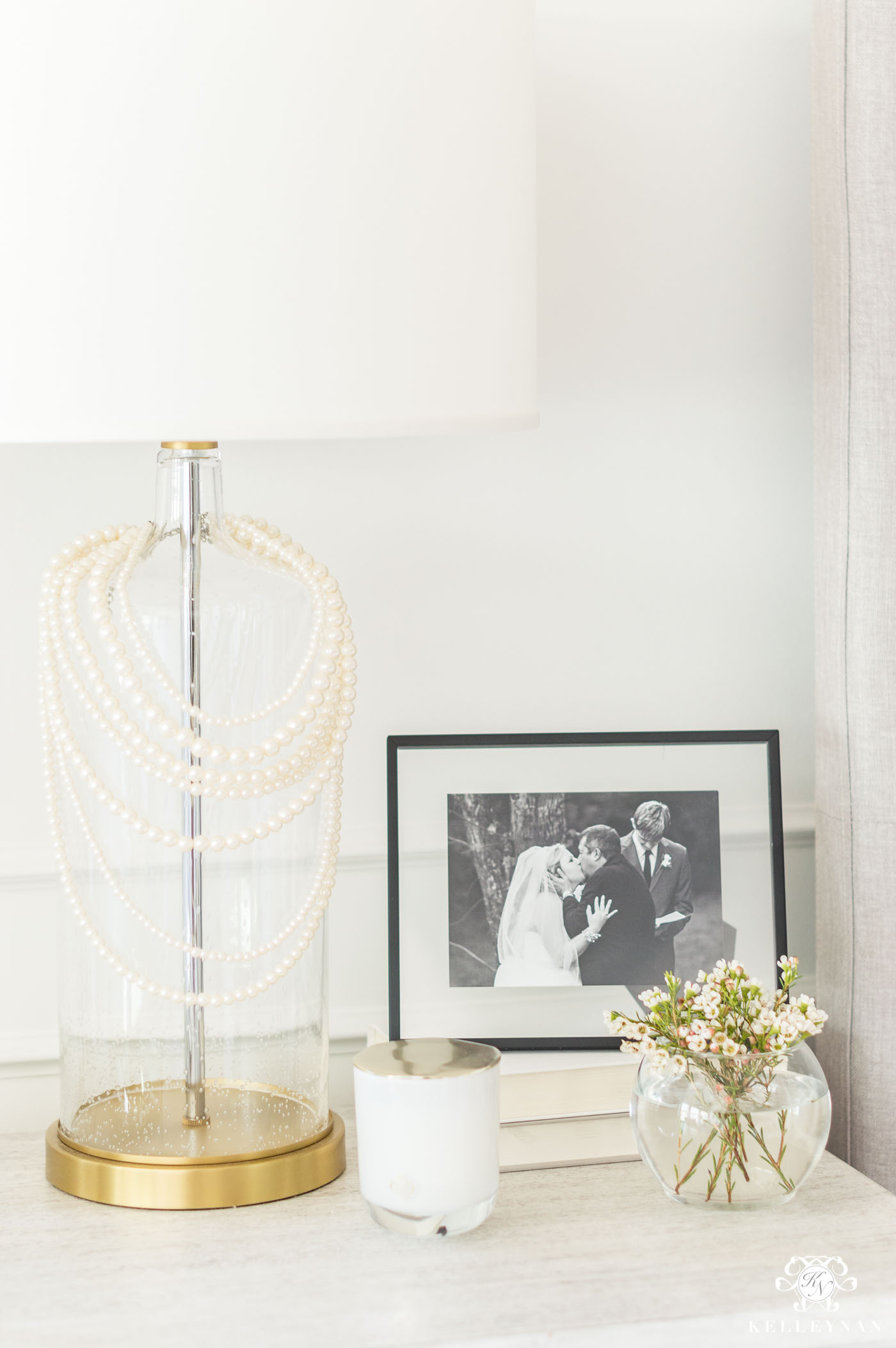 Strands of pearls on a bedside lamp