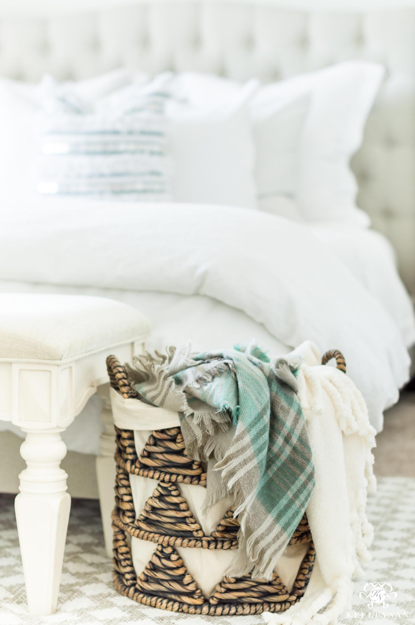 Using a basket for blankets in the bedroom