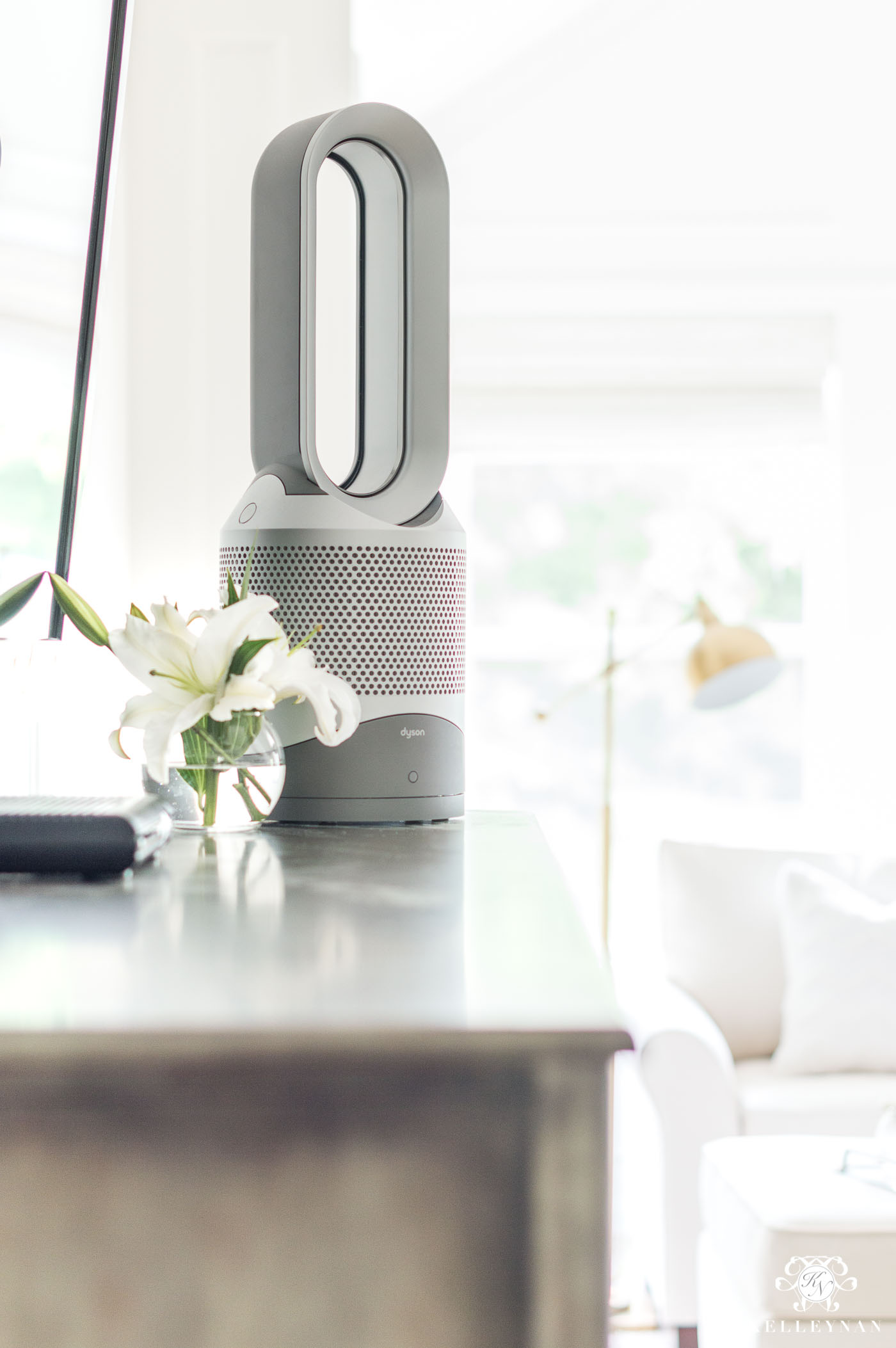 Dyson bladeless air purifier fan in the bedroom with chandelier instead of overhead fan