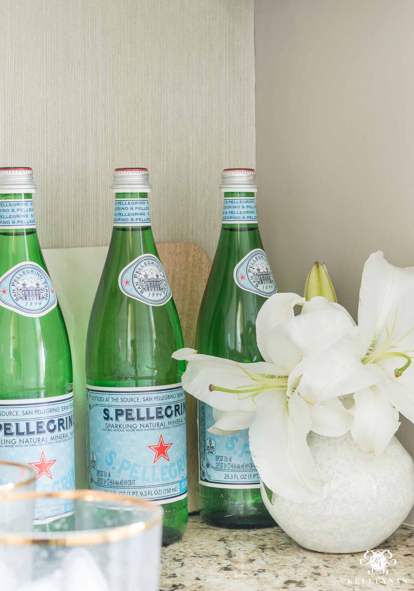 Styling kitchen counters with San Pellegrino and lillies