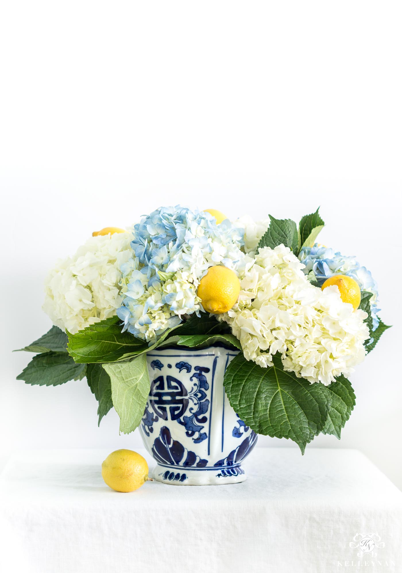 Elegant, inexpensive, southern blue and white floral centerpiece with yellow lemons