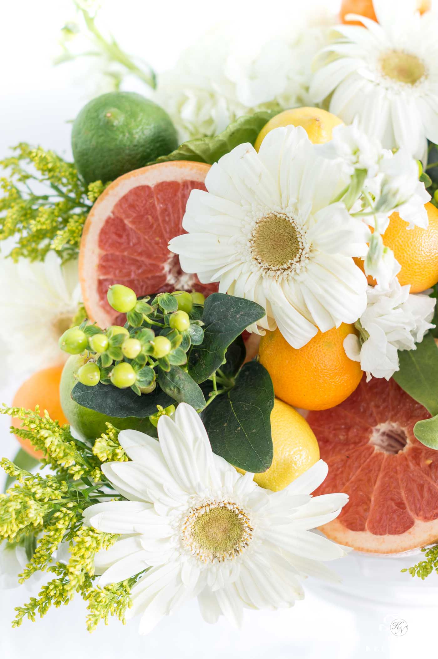 citrus and grapefruit flower arrangement centerpiece