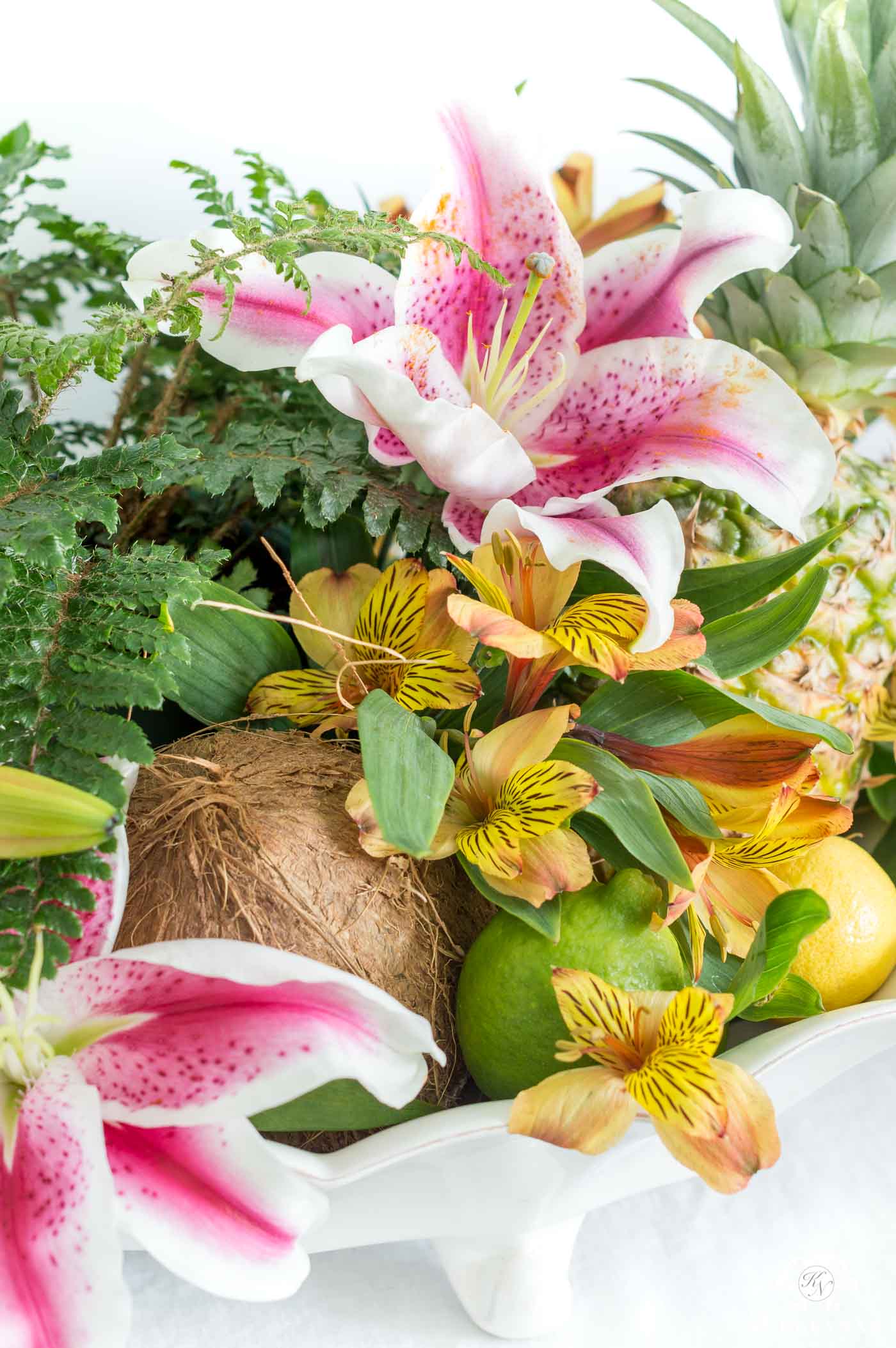 tropical centerpiece arrangement with coconut and pineapple