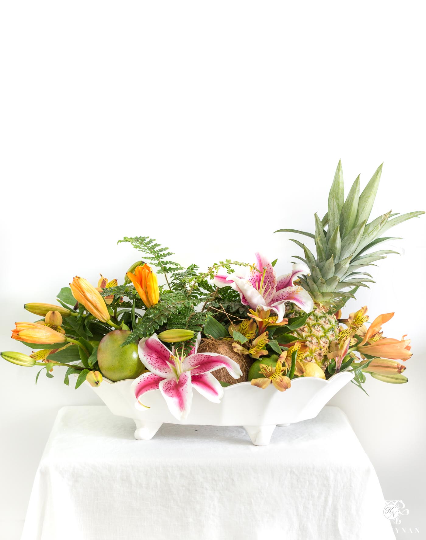 Tropical centerpiece idea with flowers and fruit