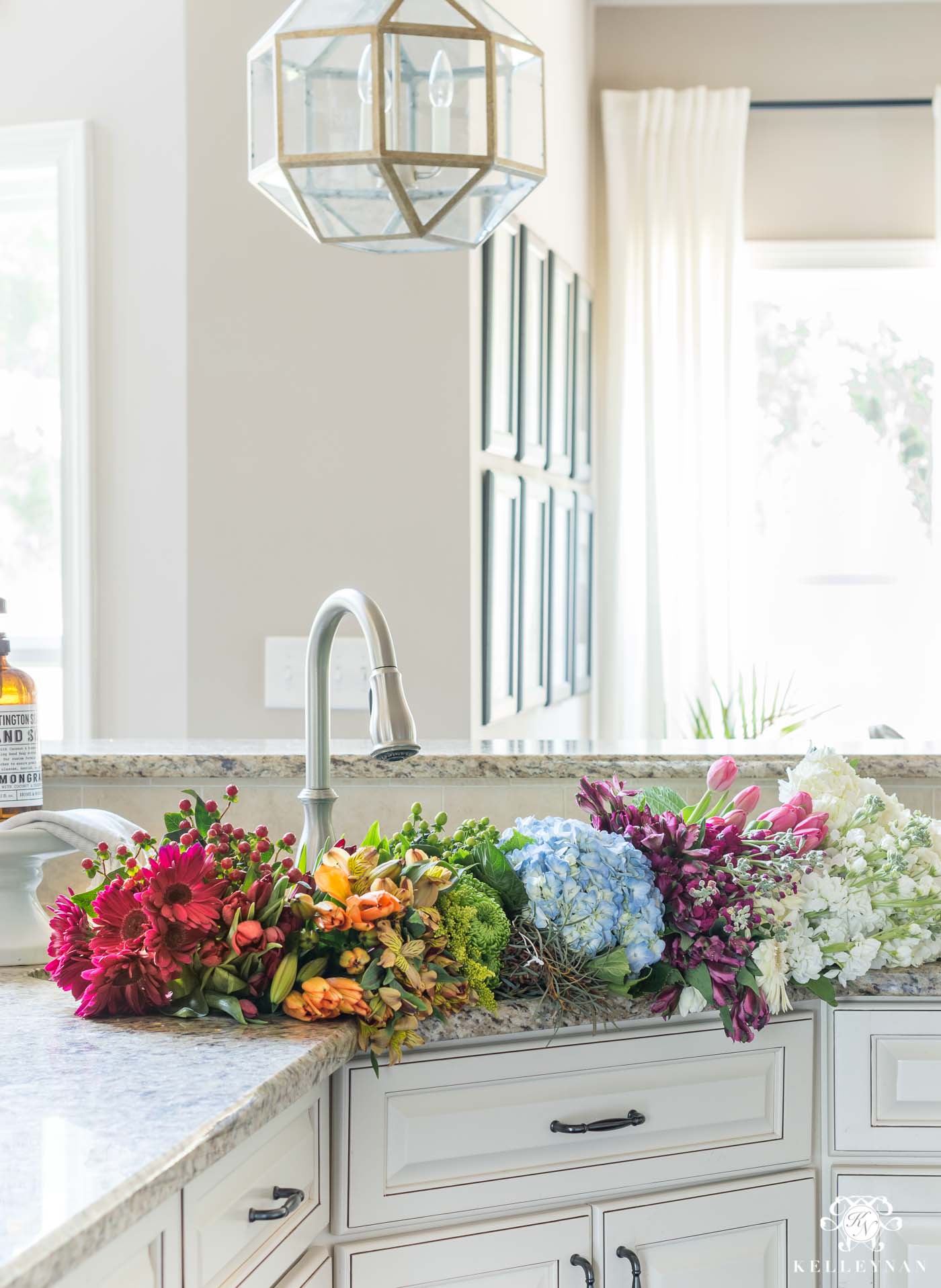 Rainbow flower assortment in the kitchen sink for centerpiece ideas