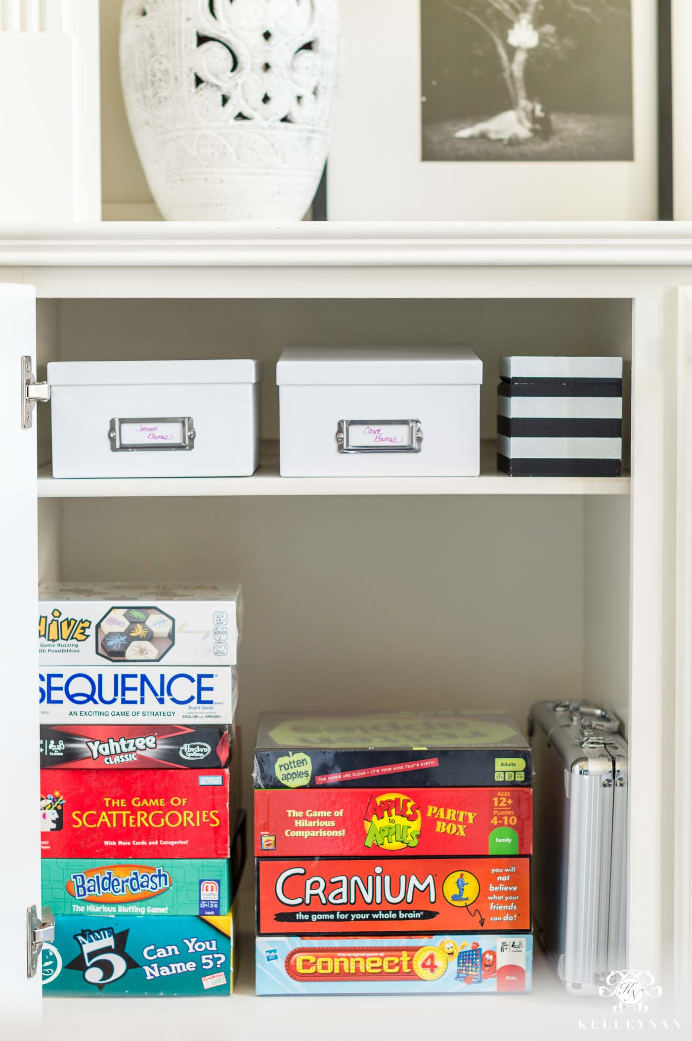 How to organize and declutter board games and playing cards in a hidden cabinet