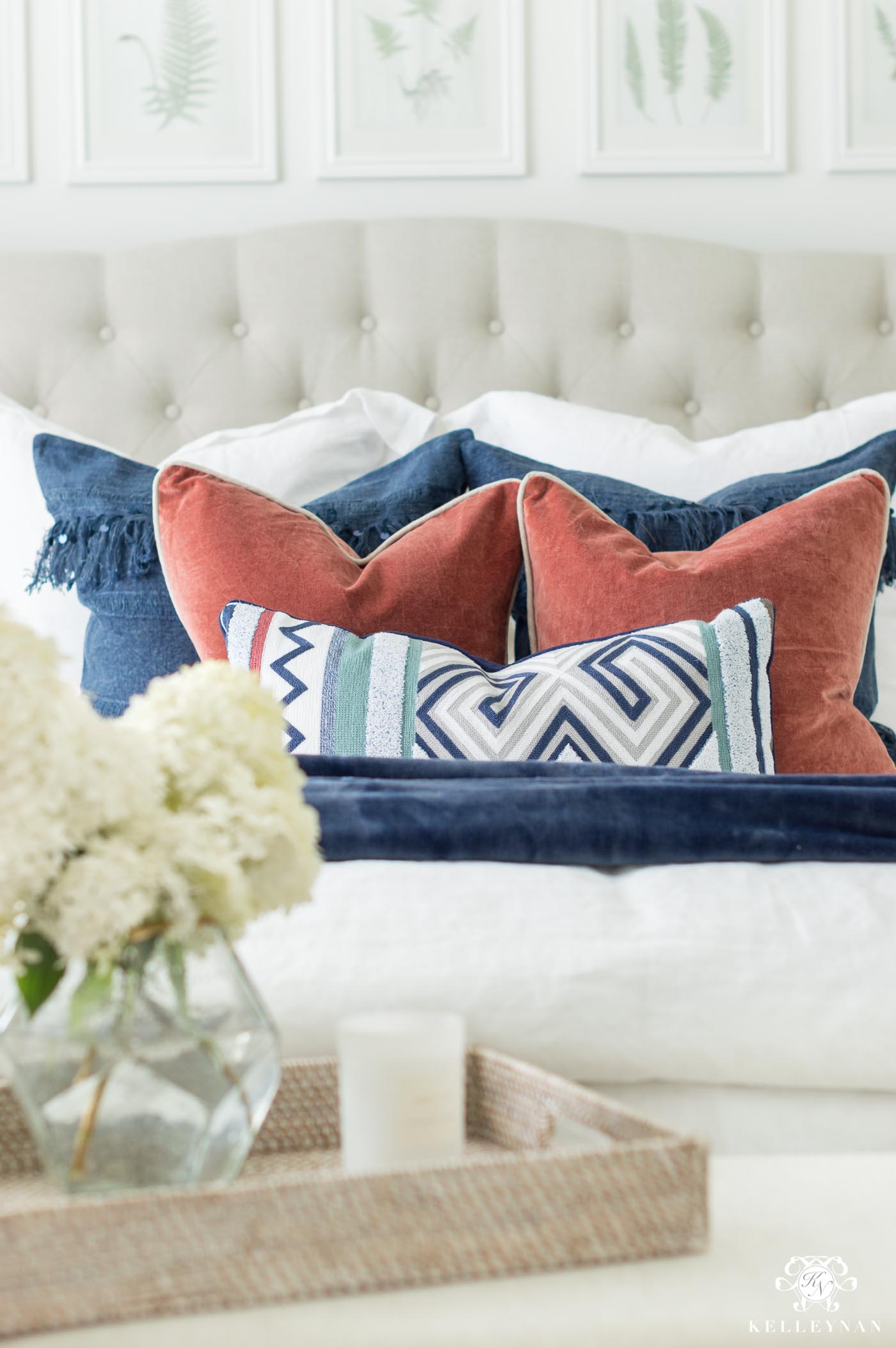 white bedding with colorful pillows