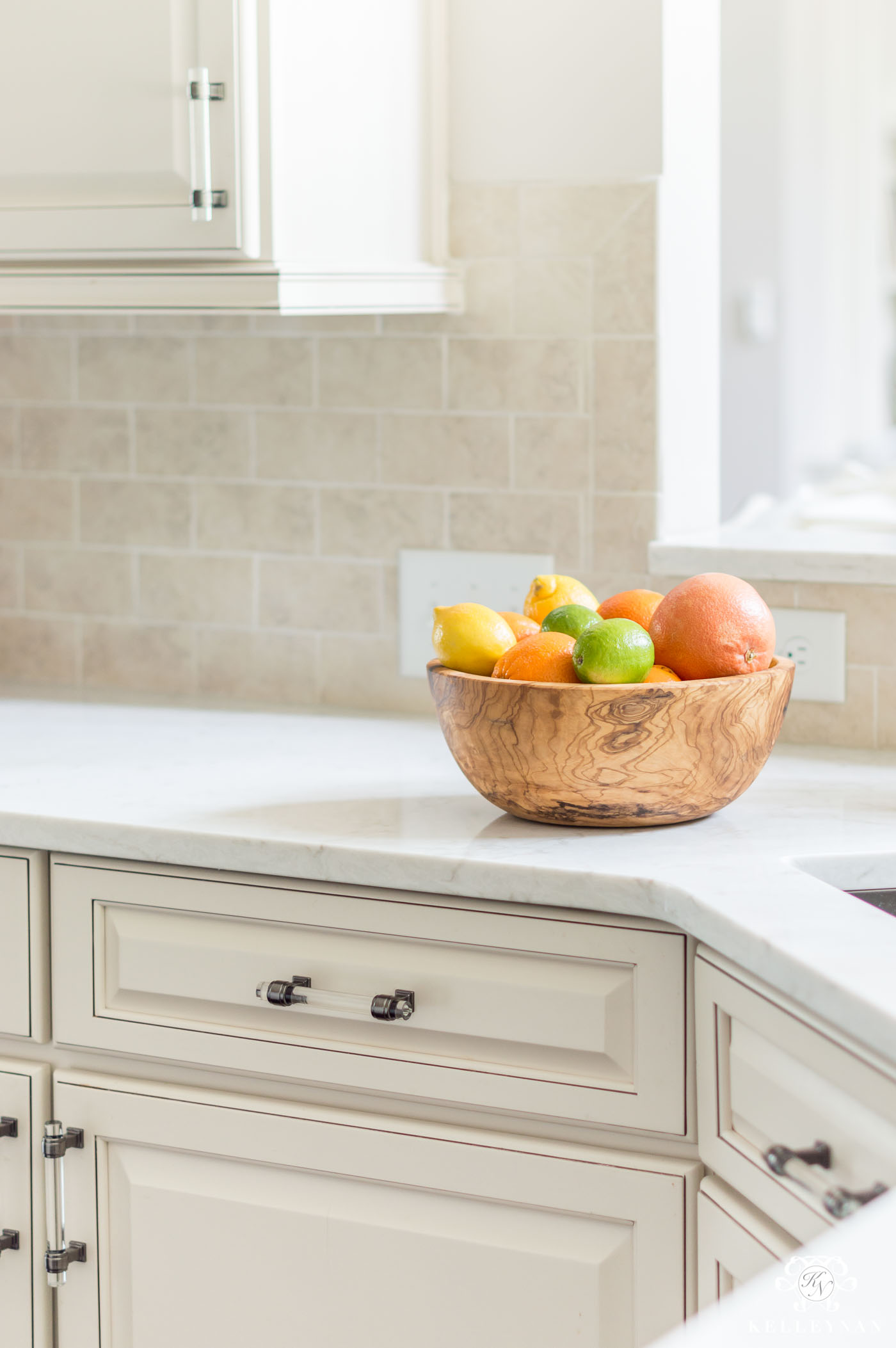 Olive wood bowl in kitchen for countertop decor 