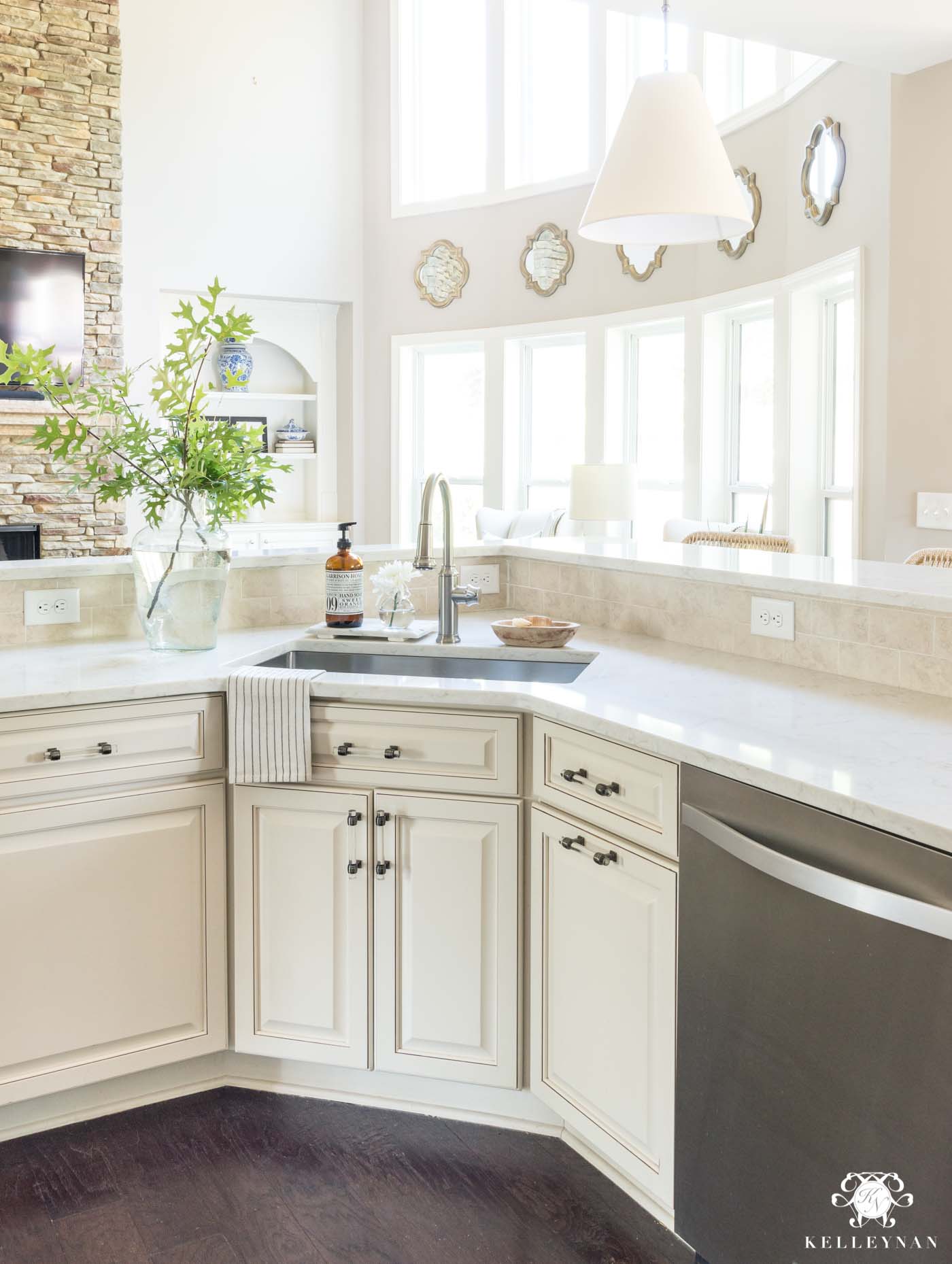 Updating an out-dated cream kitchen with white quartz countertops