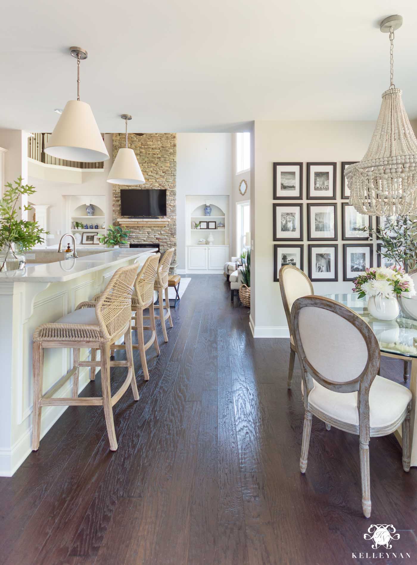 Two story great room with kitchen bar with Paper shade goodman pendants