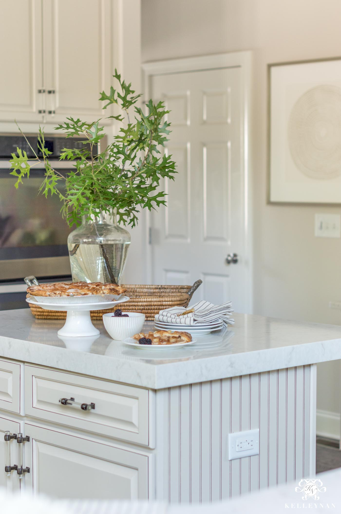 How to Make a Traditional Kitchen with Cream Cabinets More Modern with Marble-Like Quartz