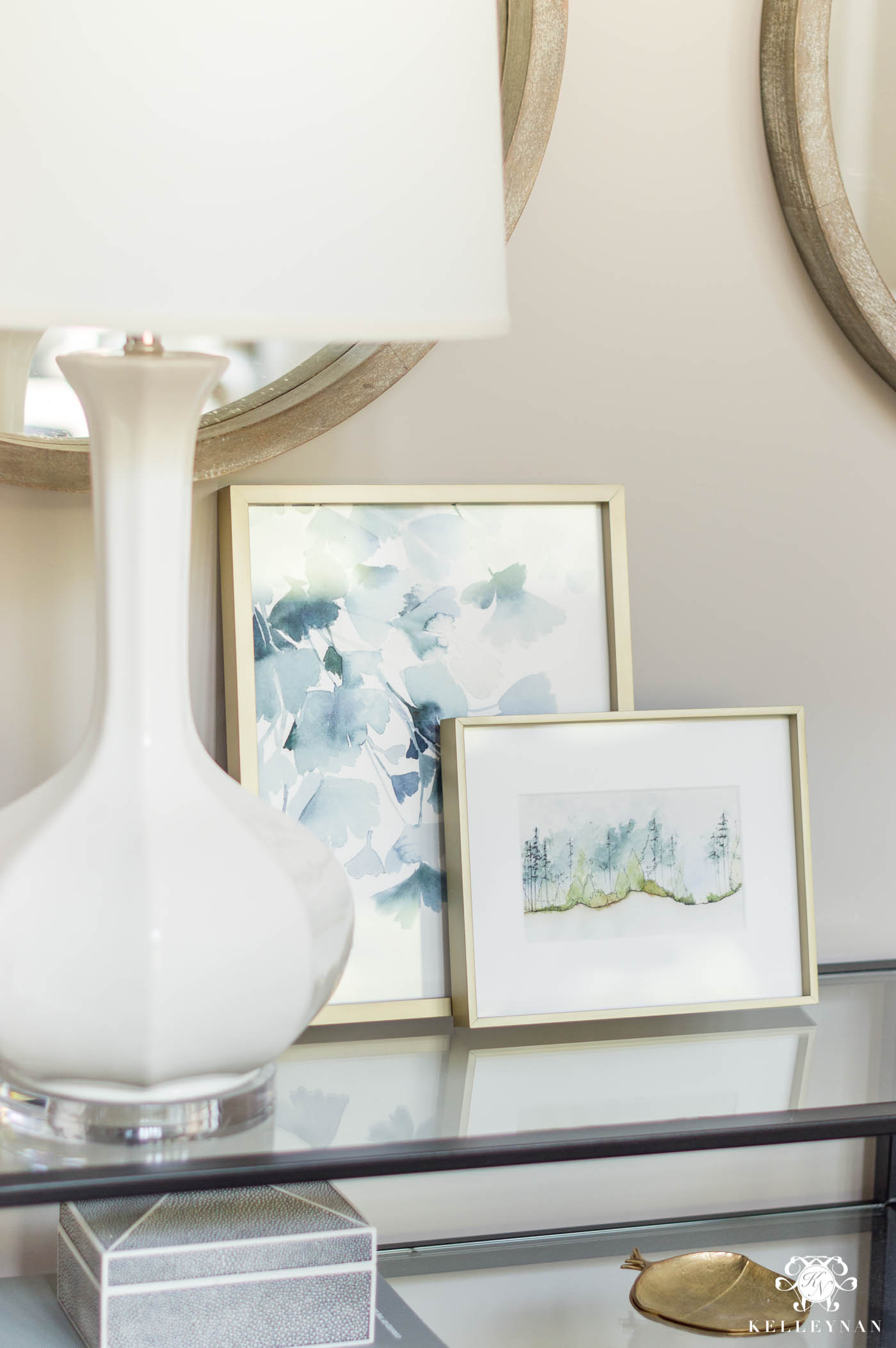 Layered art on console table