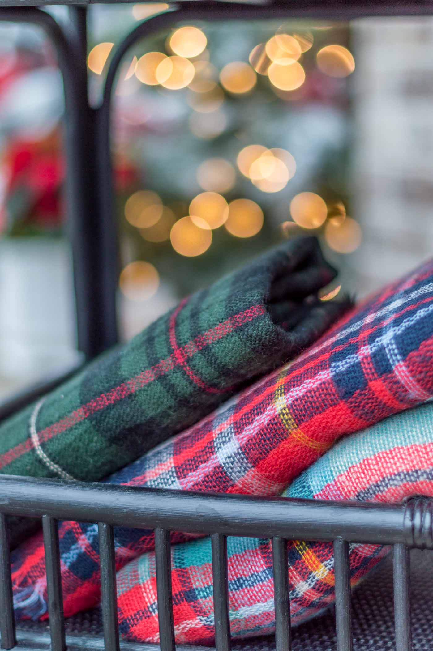 Cozy Christmas Porch Decor with Tartan and Plaid Blankets