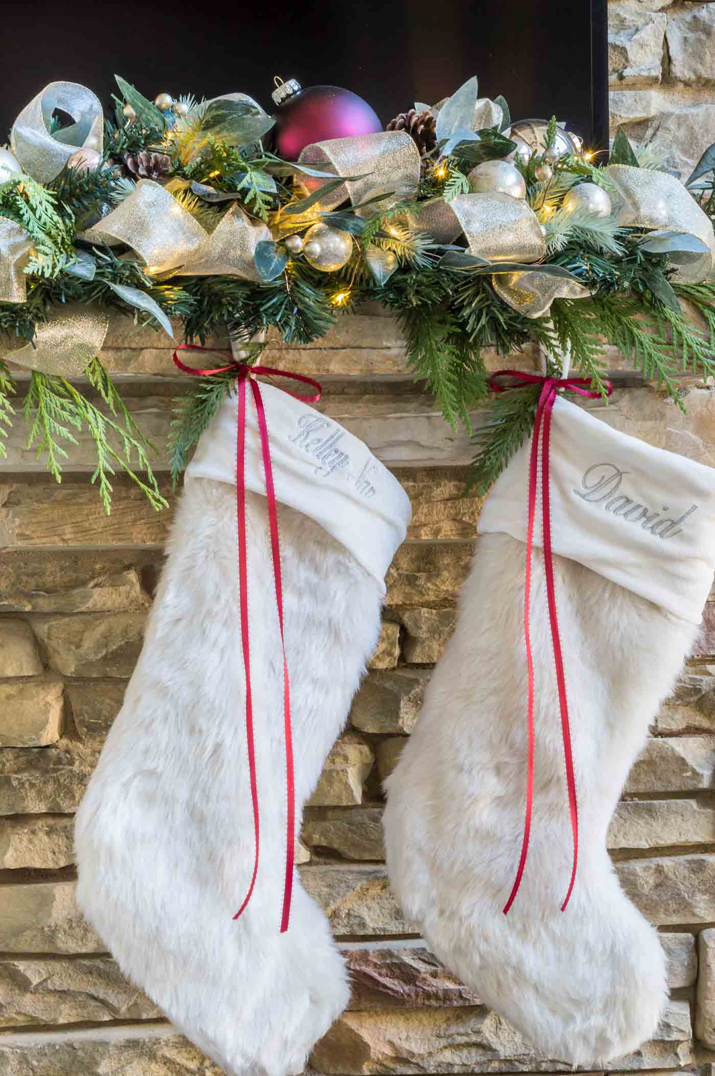 Christmas fireplace ideas with stocking hung with ribbon and garland