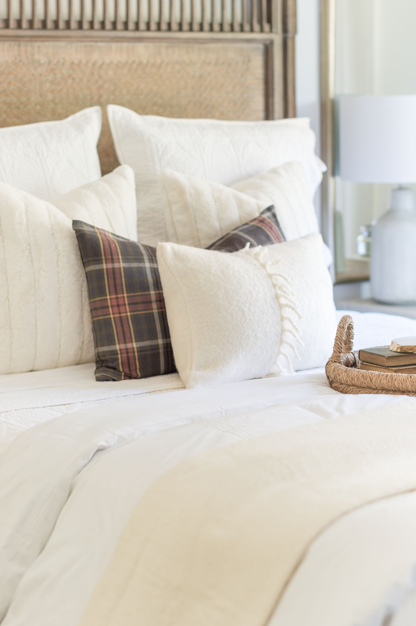 neutral bedding with pop of plaid