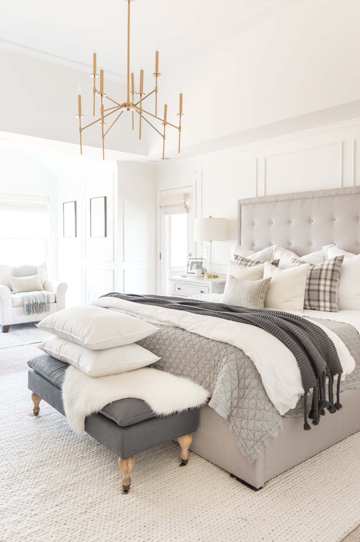 Neutral winter bedroom ideas with layers and gray and white plaid