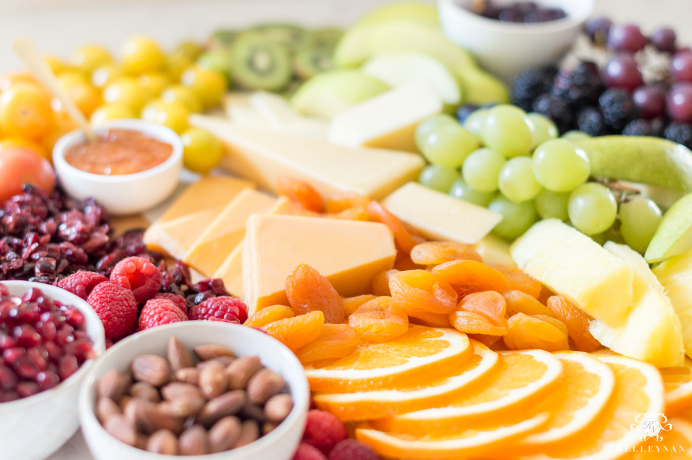 Rainbow fruit and cheese charcuterie board for St. Patrick's Day food ideas