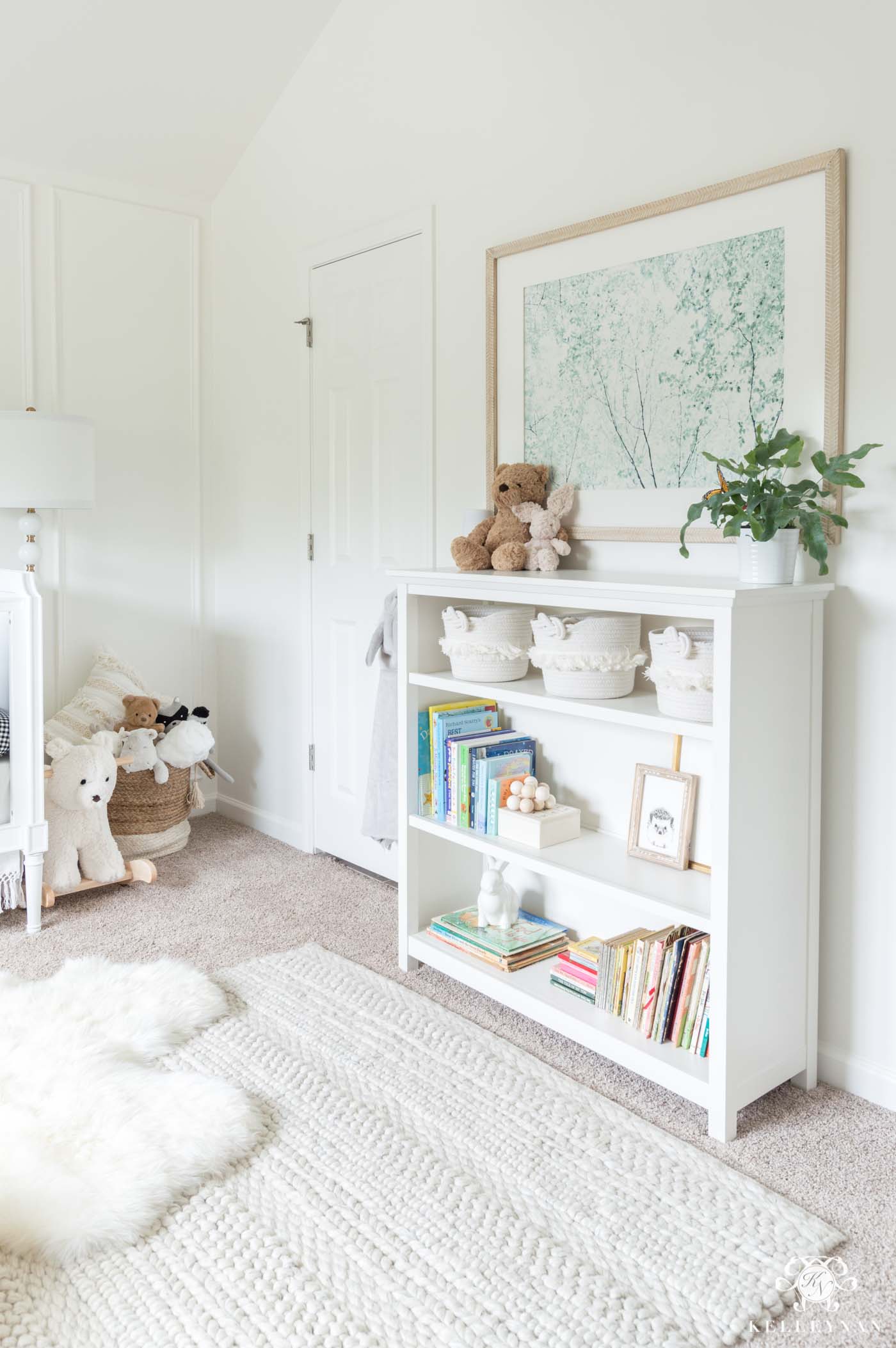 Baby room styled bookshelf and decor