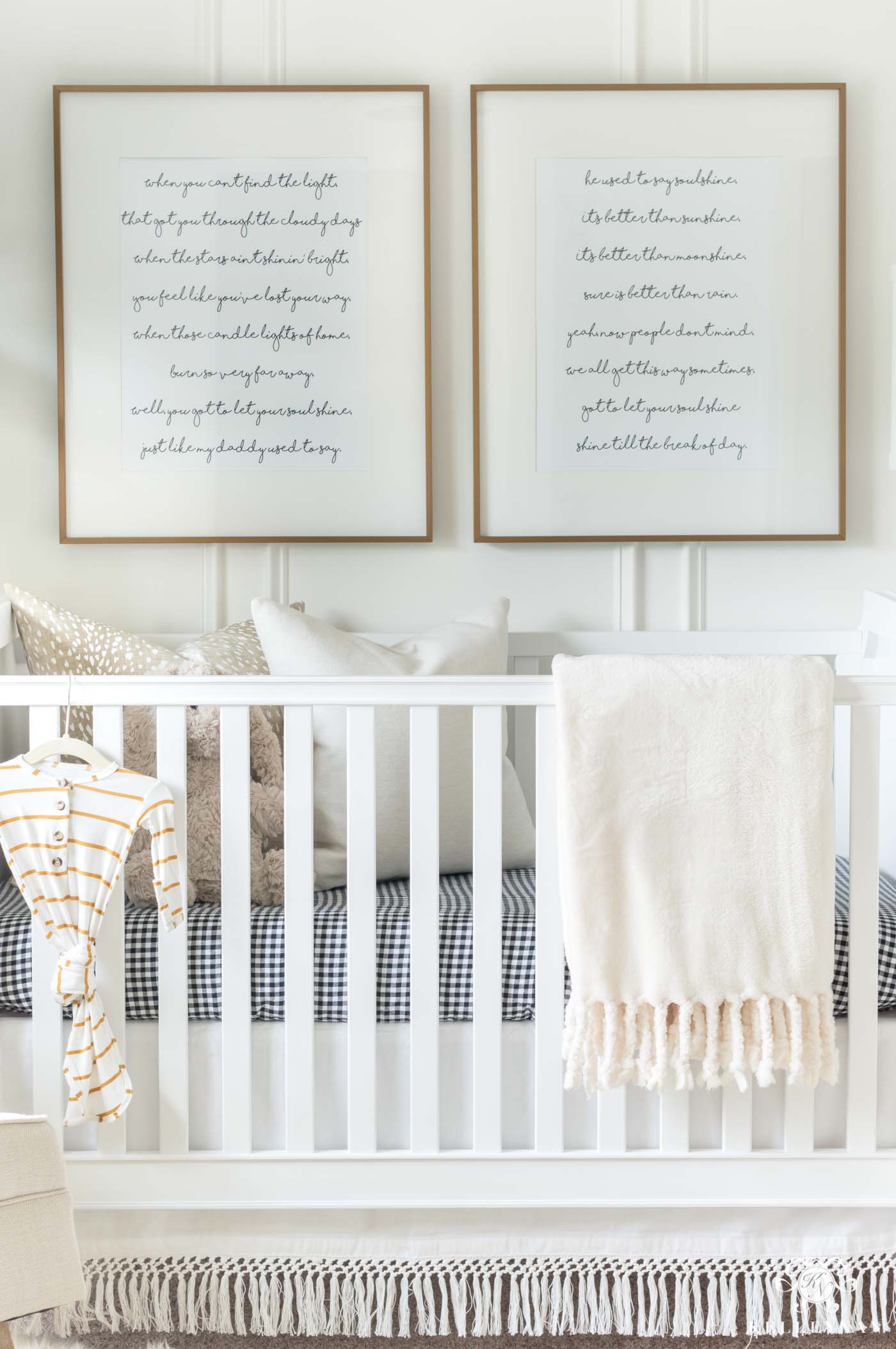 Framed song lyrics above the nursery crib