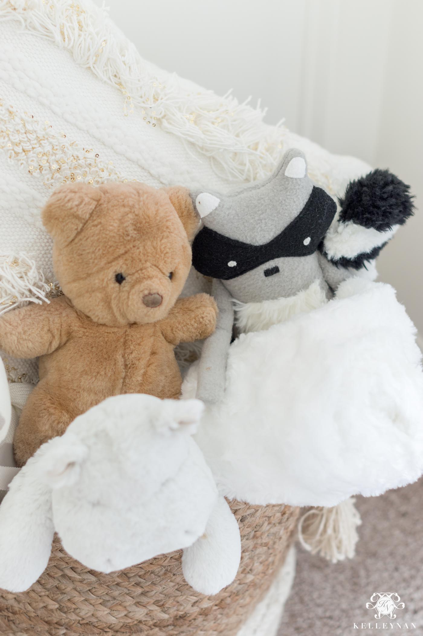 stuffed animals in nursery basket