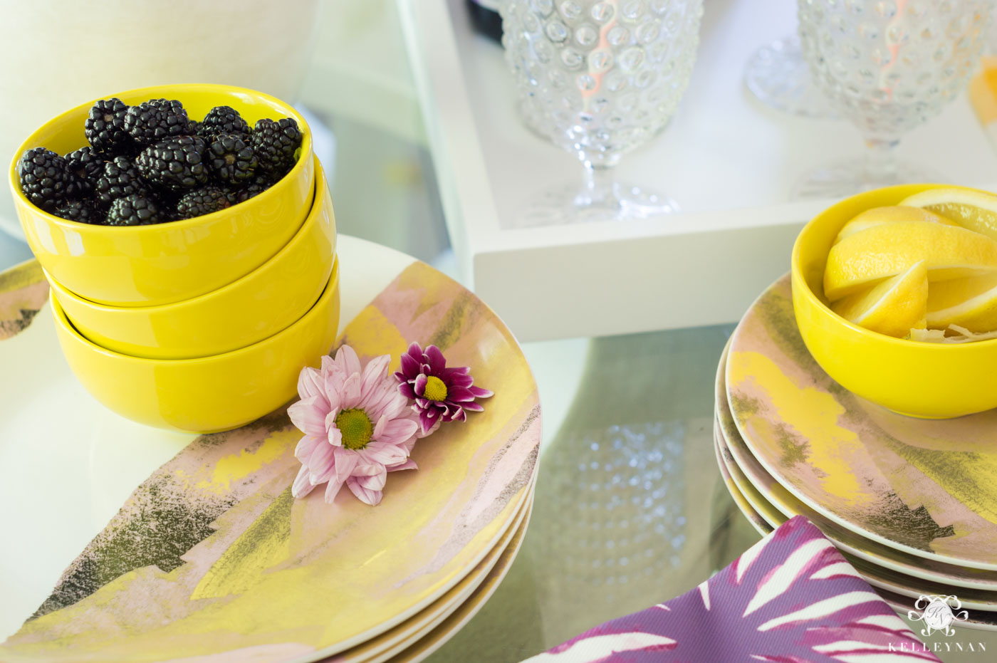 Drew Barrymore Flower Line Favorites with yellow and purple flower scheme