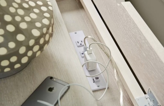 Nightstand with hidden outlets for a bedside charging station