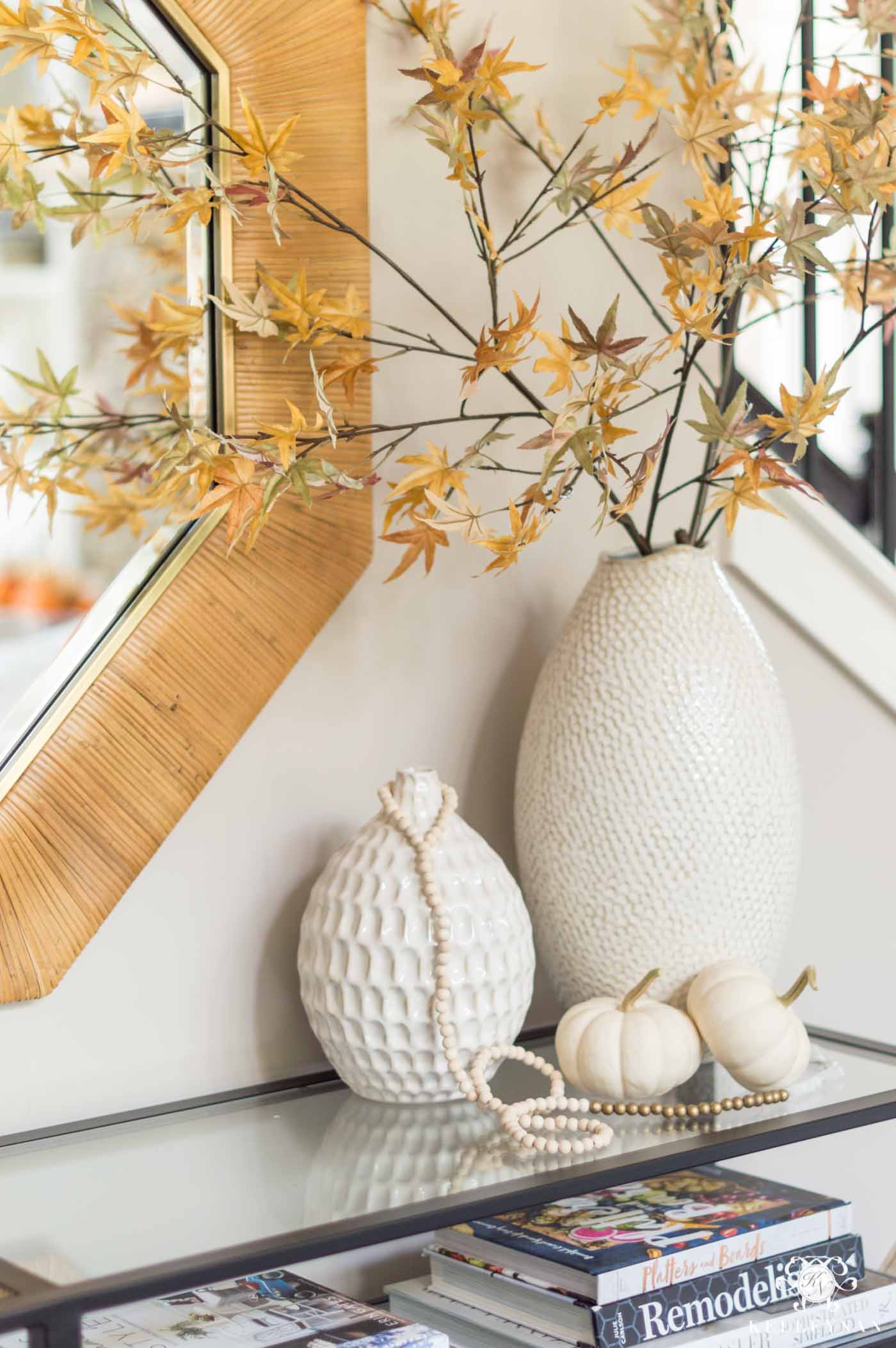 Fall home decor with leaves and pumpkins