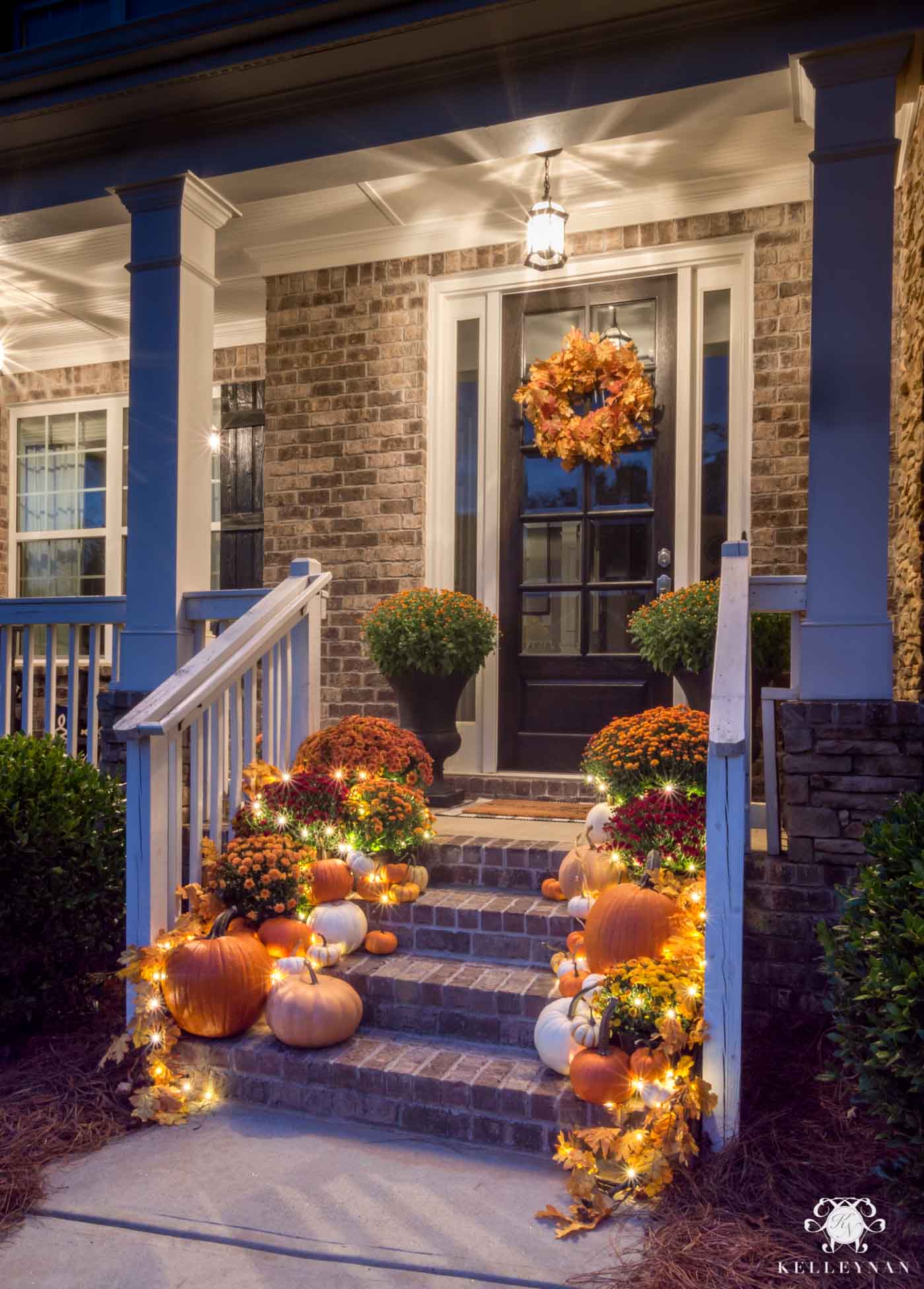 Nighttime fall front porch decor